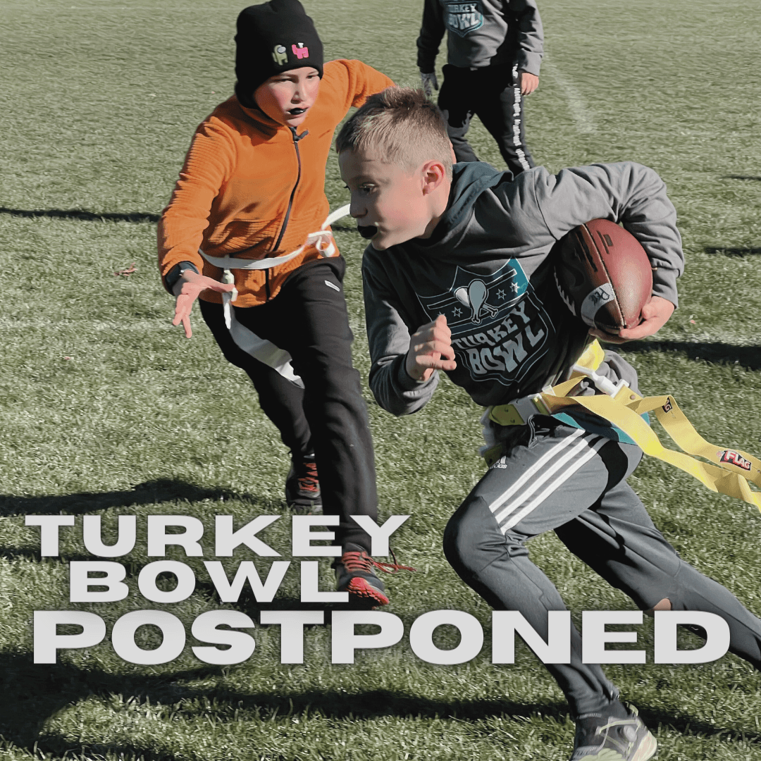 two boys running in a flag football game with text: 'Turkey Bowl Postposed' 