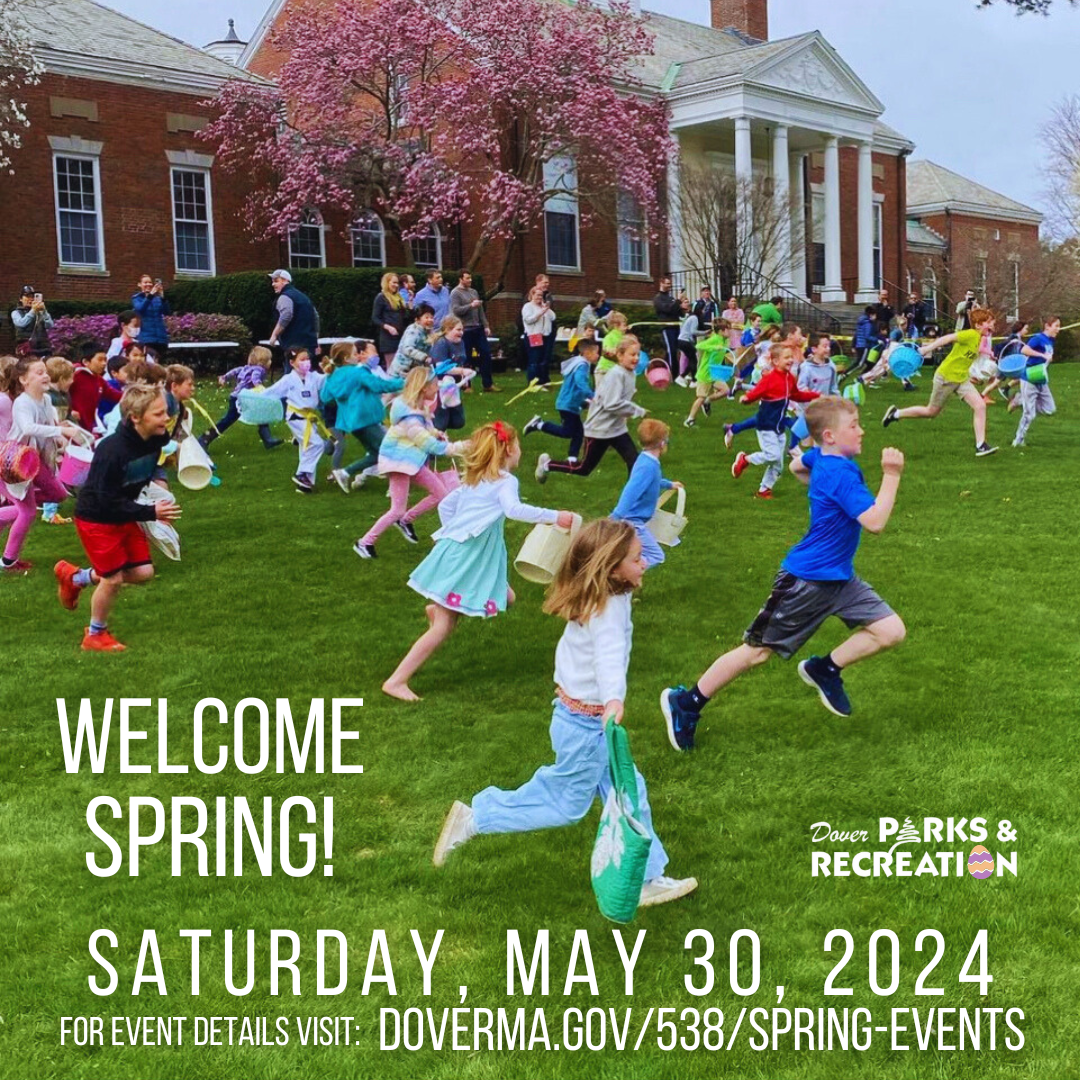 Dozens of children running across the grass towards the spring egg hunt