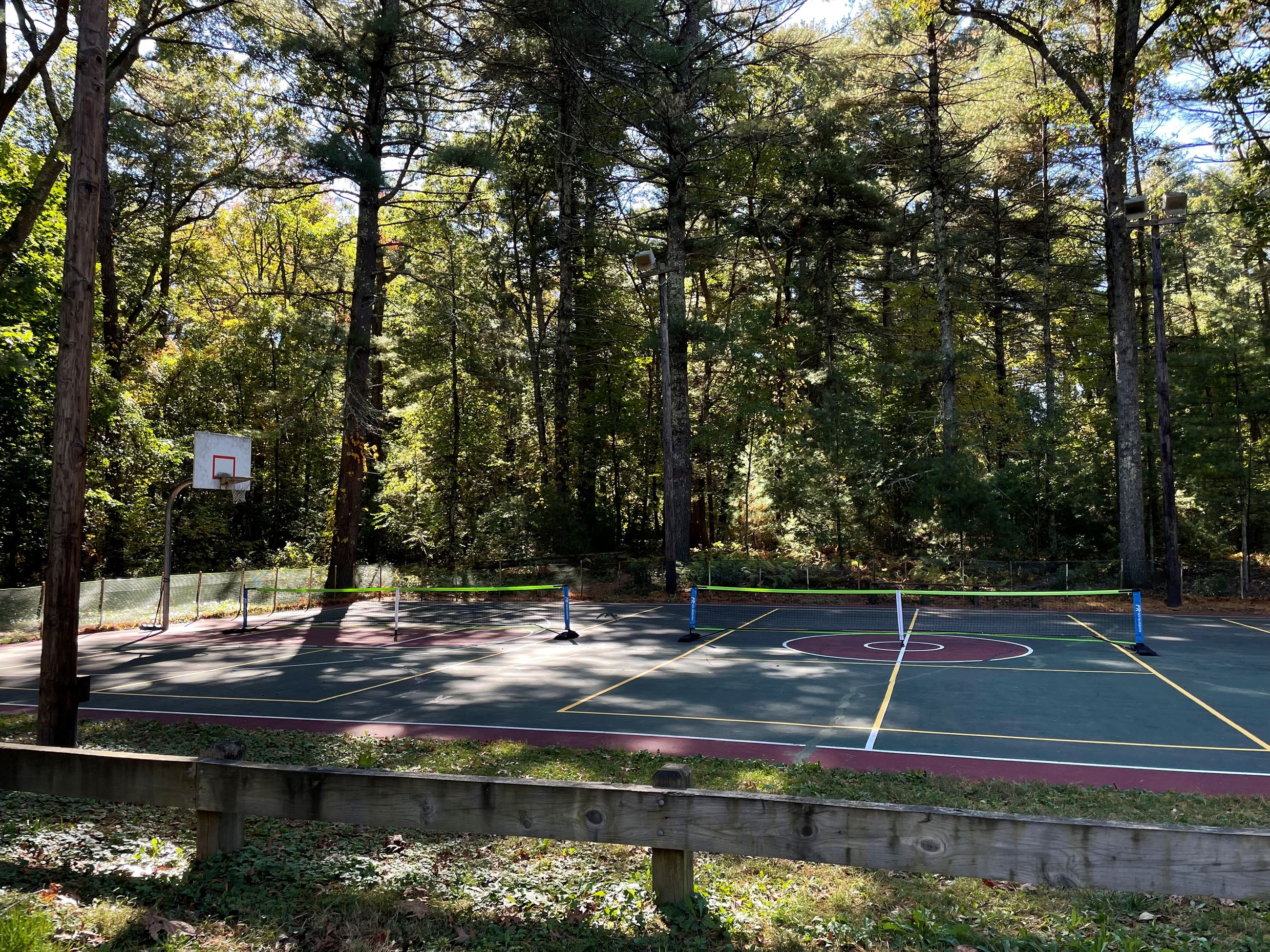 Photo of the Basketball and Pickleball Courts with Pickleball nets on the court