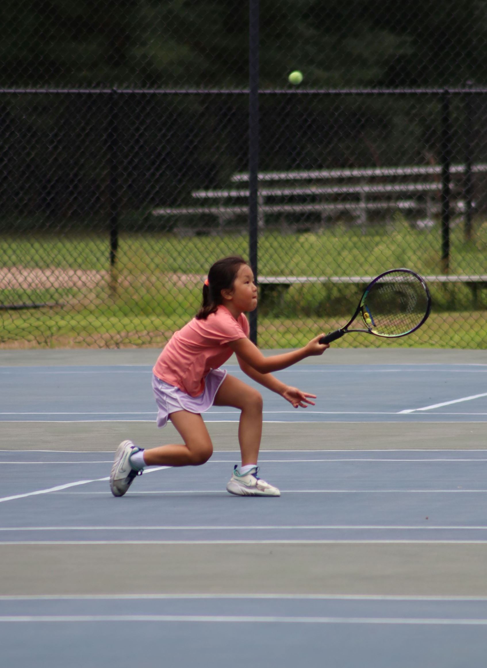 Photo of girl getting into ready position with racket