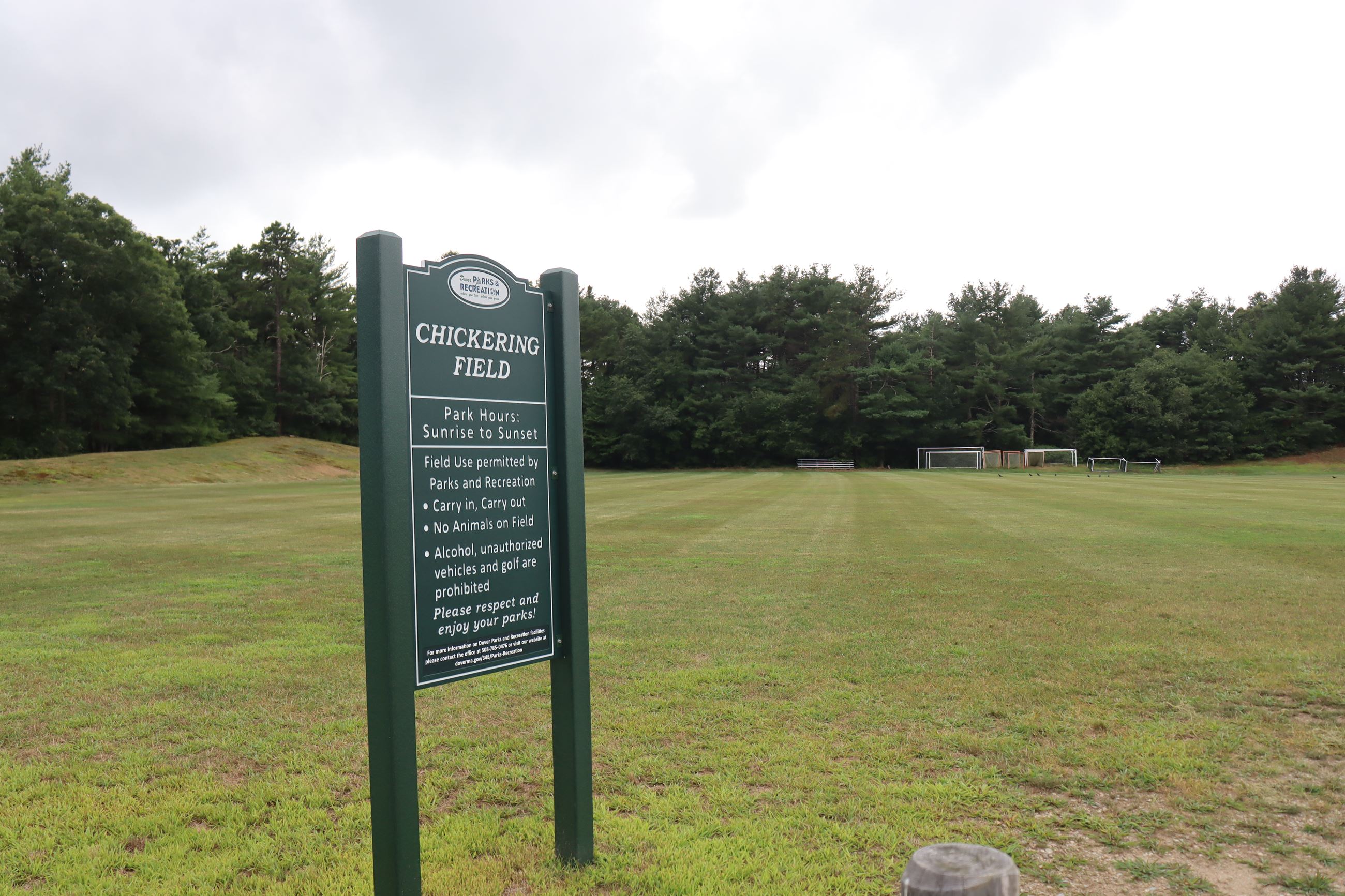 Photo of Chickering Fields with sign and soccer net in background